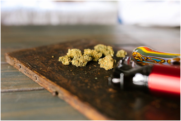 Marijuana buds on a wooden surface